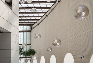 A room with a bunch of mirrors hanging from the ceiling