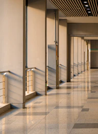 A long hallway with a clock on the wall