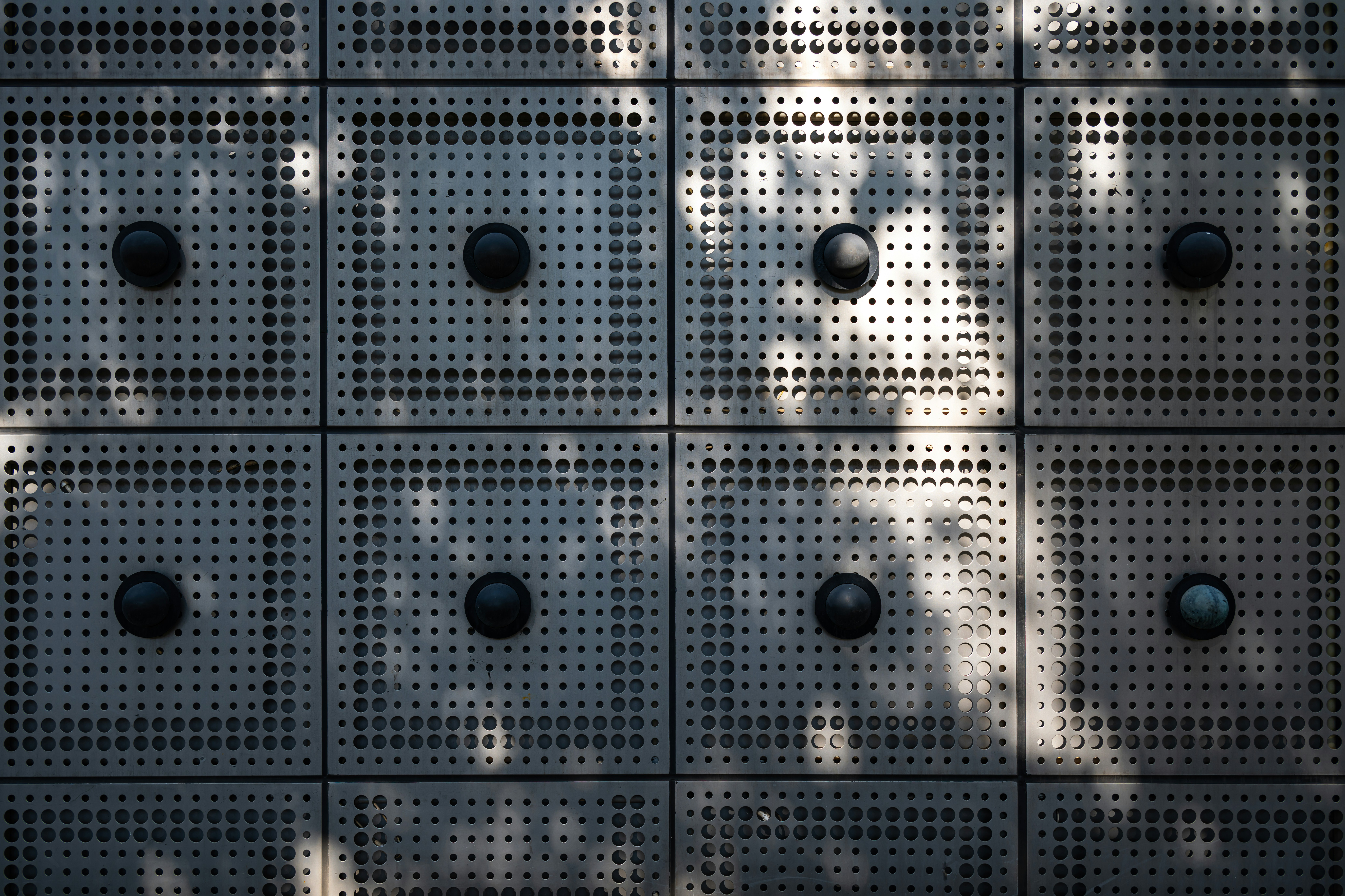 A wall with a bunch of holes in it