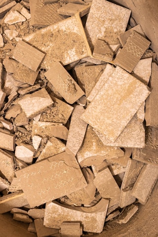 A bowl filled with lots of brown and white tiles