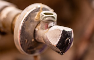 A close up of a water faucet with nozzles