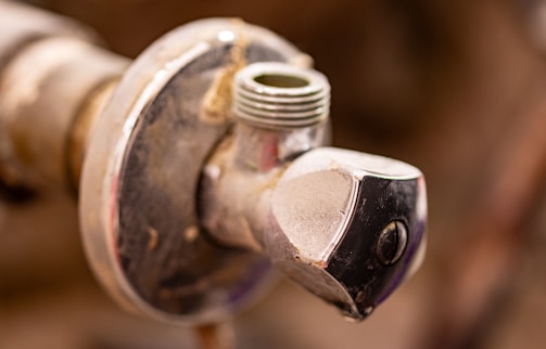 A close up of a water faucet with nozzles