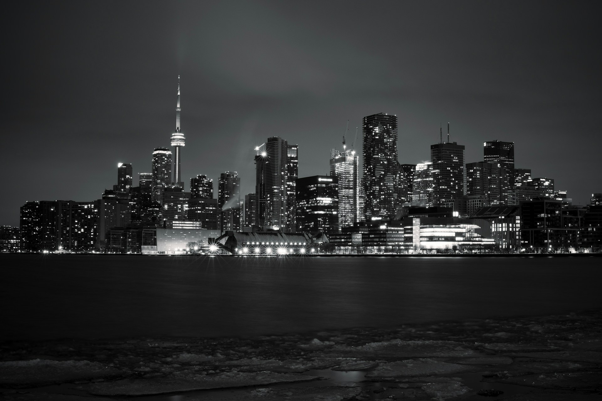 A black and white photo of a city at night