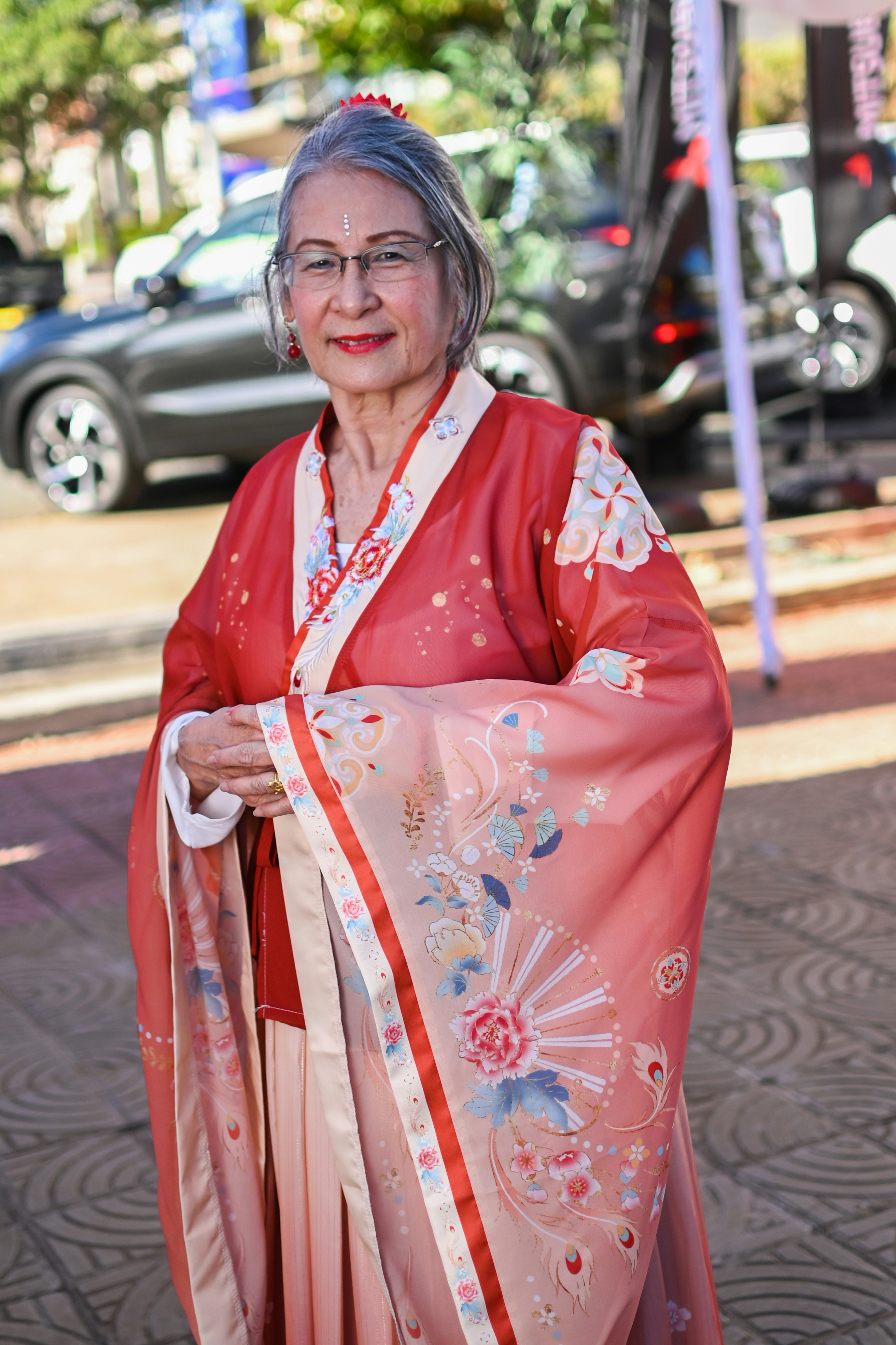 A woman in a kimono walking down the street
