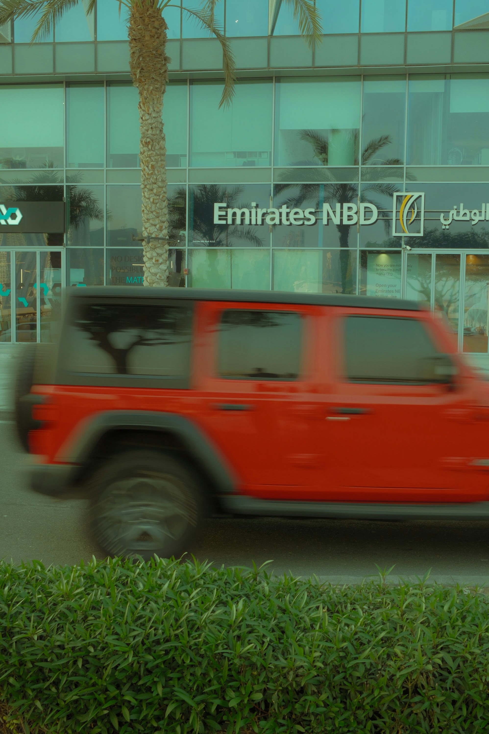 Chauffeur opening car door for passengers in Dubai