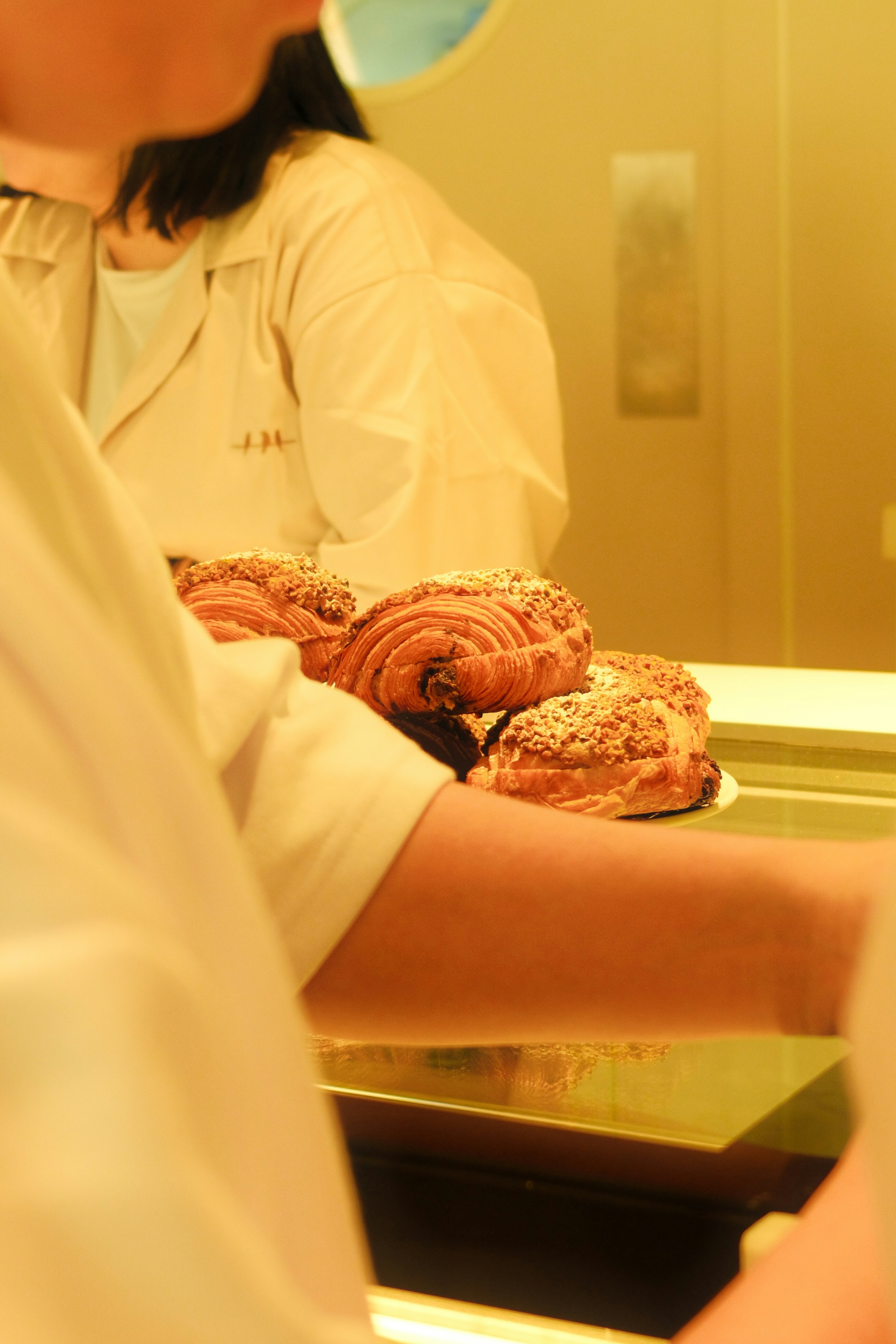 A person in a white shirt and some food