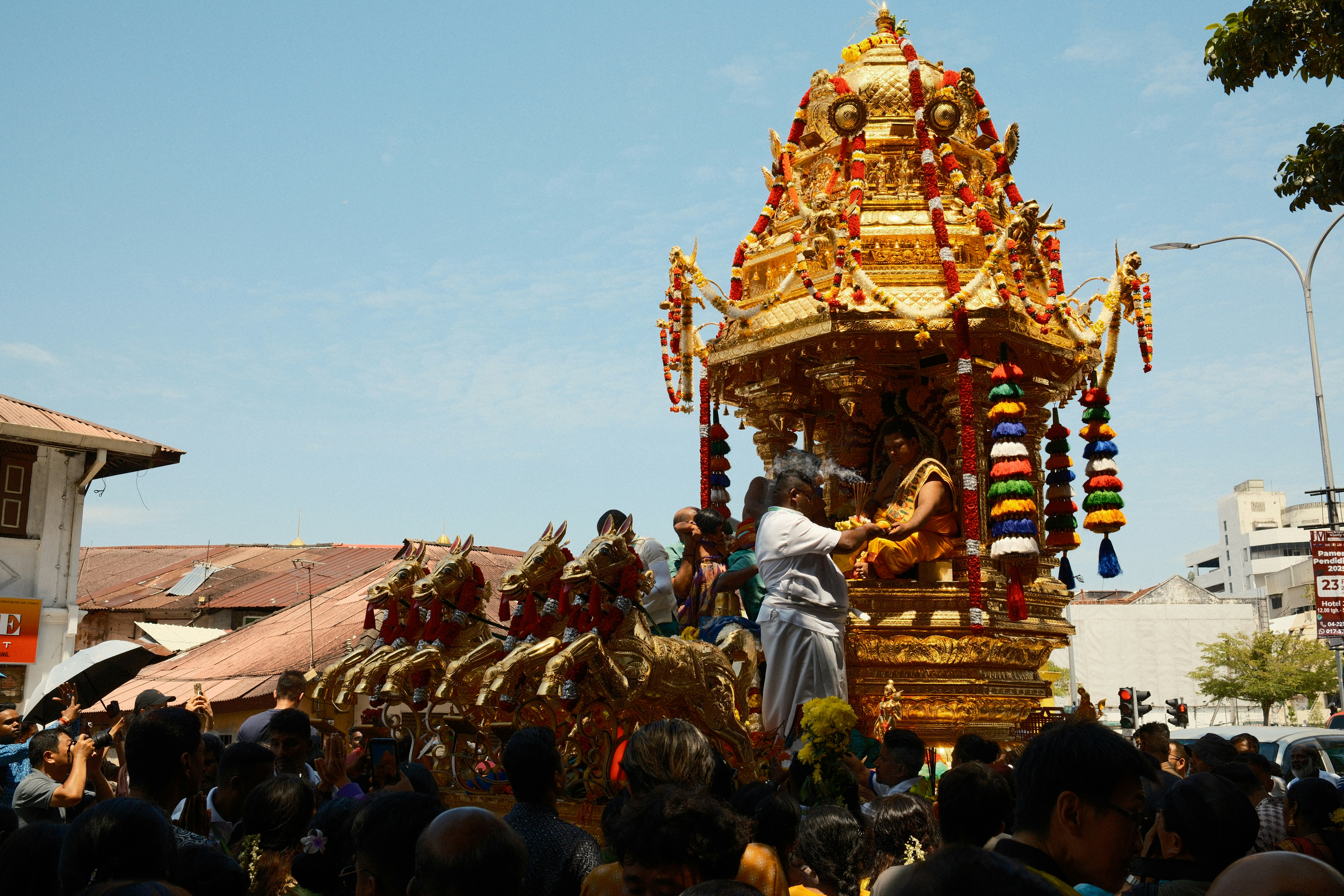 A group of people standing around a float in a parade