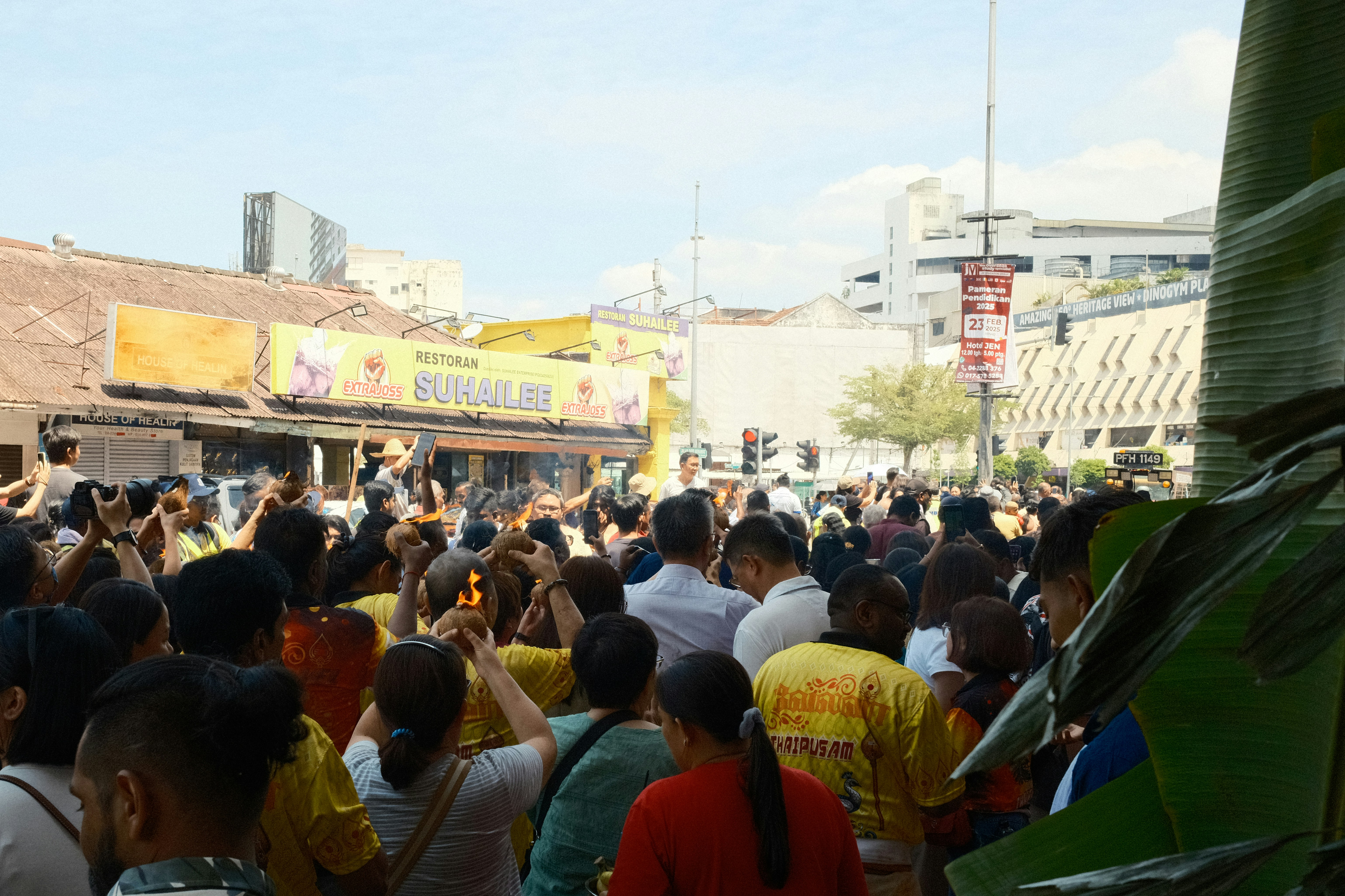 A large group of people walking down a street