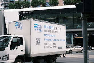 A delivery truck driving down a city street
