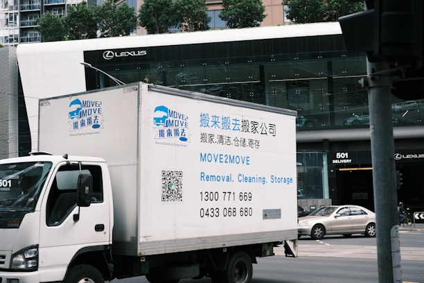A delivery truck driving down a city street