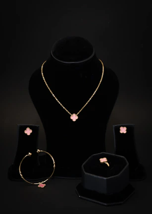 A necklace, bracelet, ring and earring set