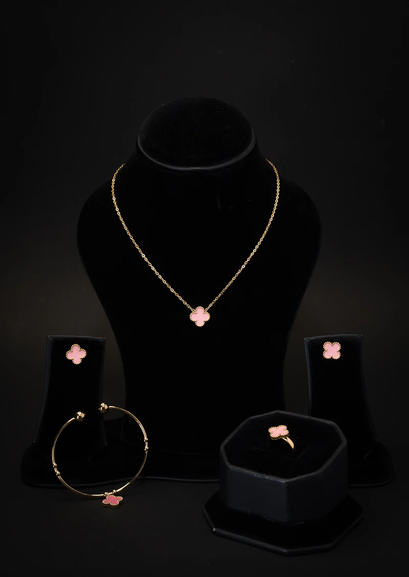 A necklace, bracelet, ring and earring matching set