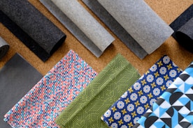 A bunch of different types of fabric on a table