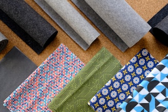 A bunch of different types of fabric on a table