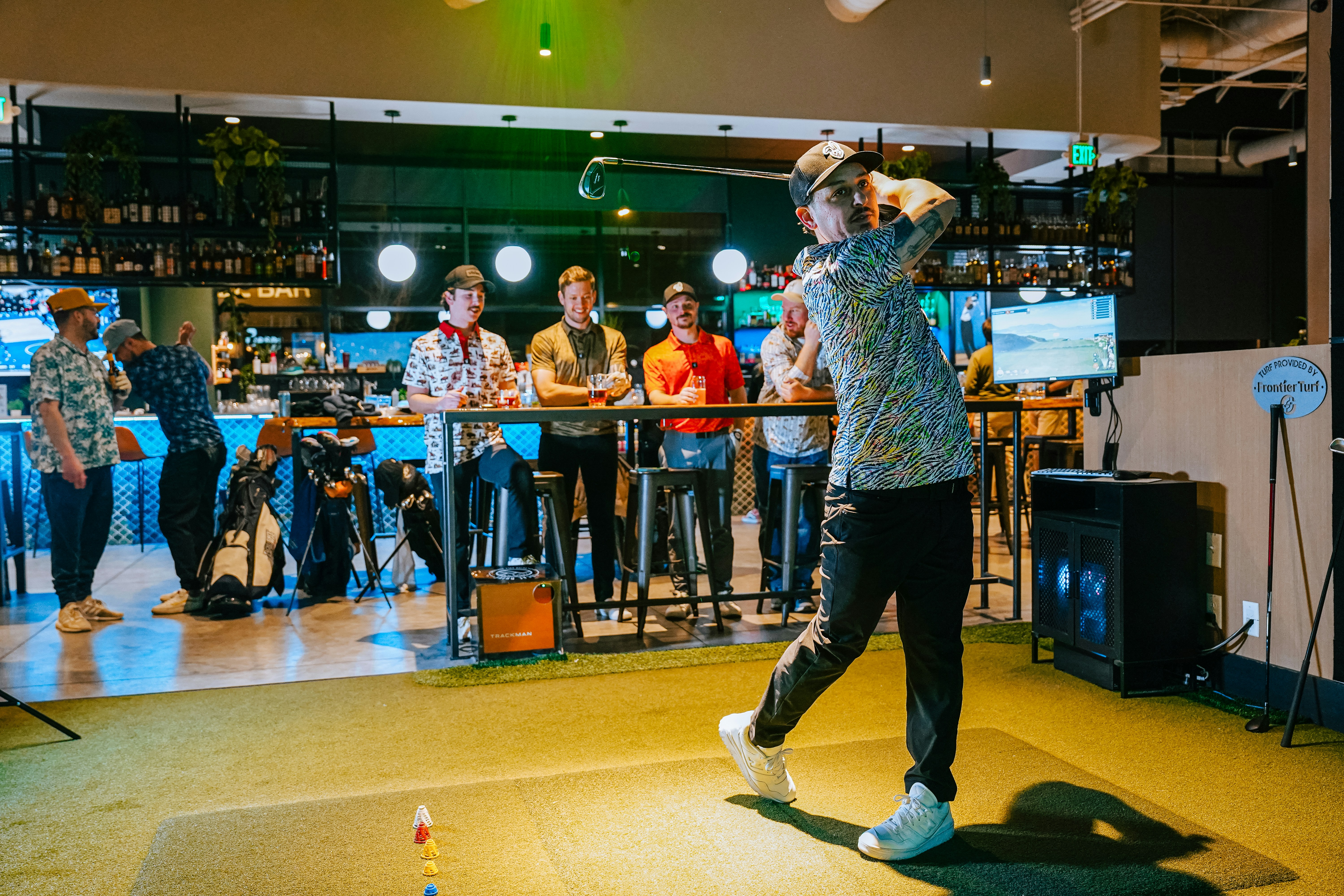 A man standing on top of a wooden floor