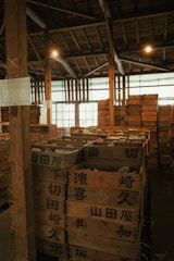 A warehouse filled with lots of wooden pallets