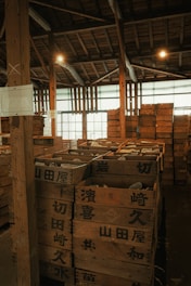 A warehouse filled with lots of wooden pallets
