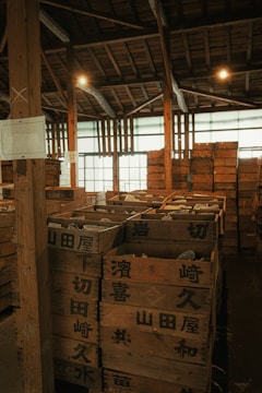 A warehouse filled with lots of wooden pallets