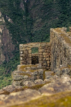 A view of a mountain with a cliff in the background