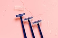 Three blue disposable razors