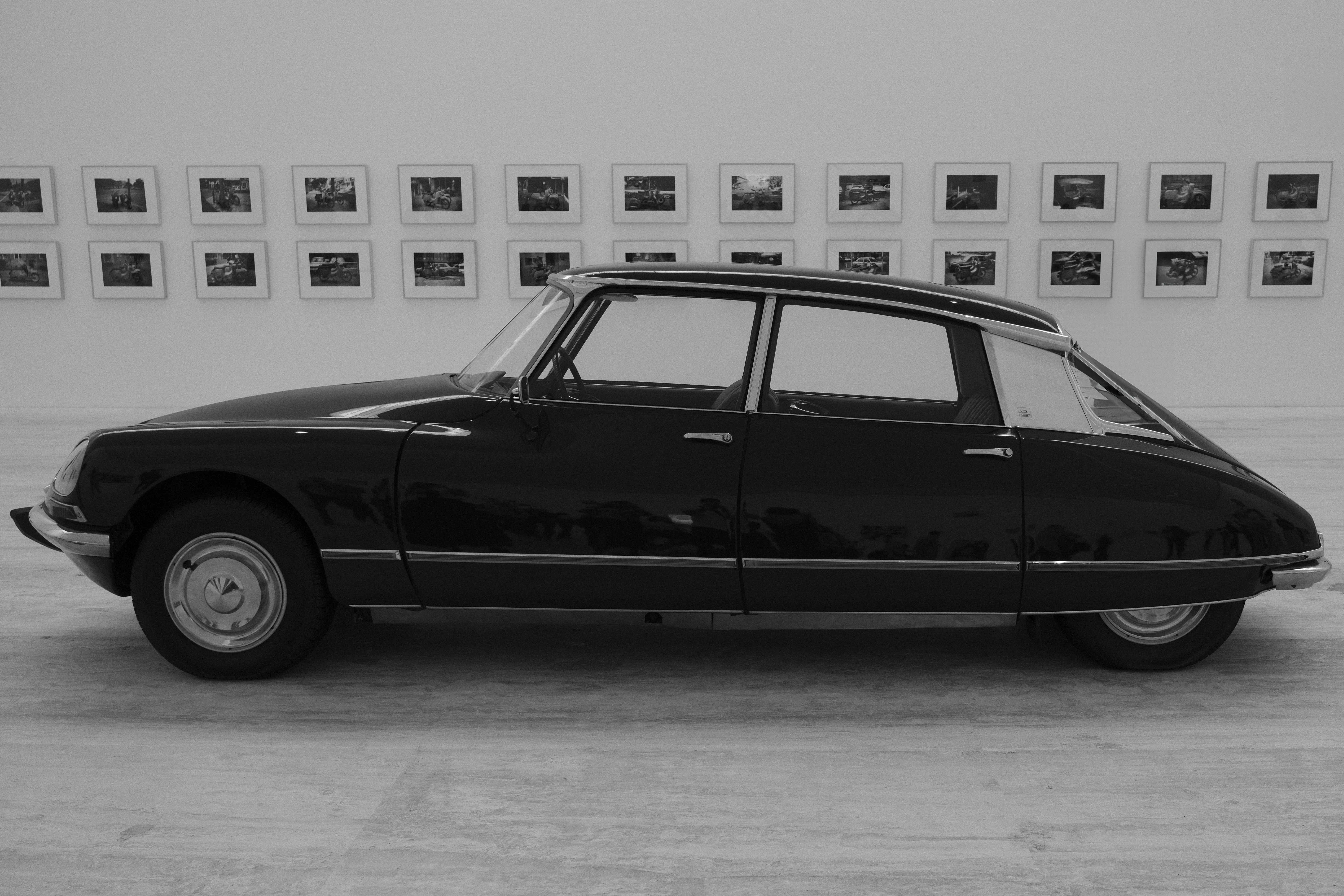 A black and white photo of an old car