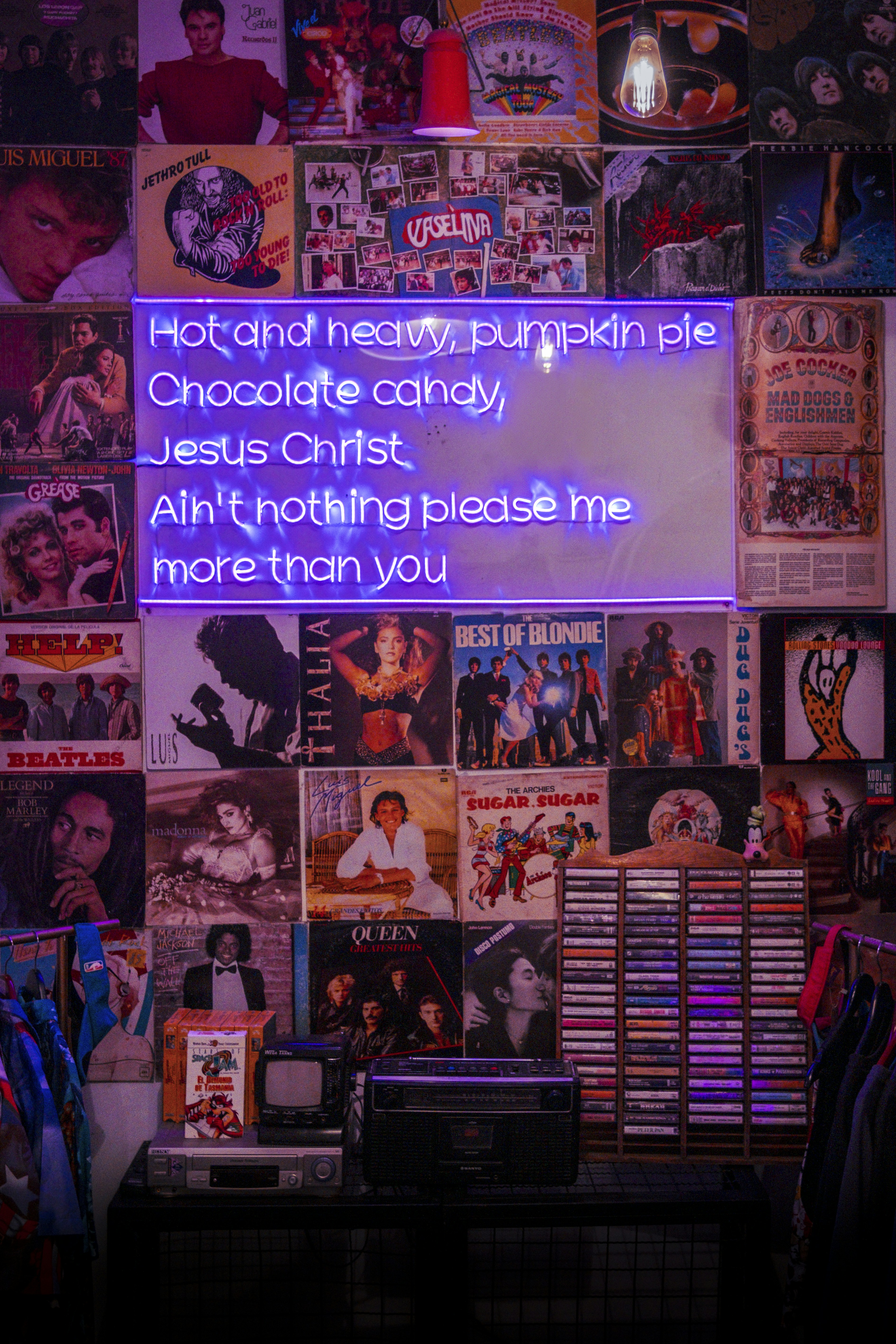 A room with a bunch of posters on the wall