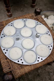 A tray of food sitting on top of a wicker table