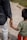 A man holding the hand of a small child
