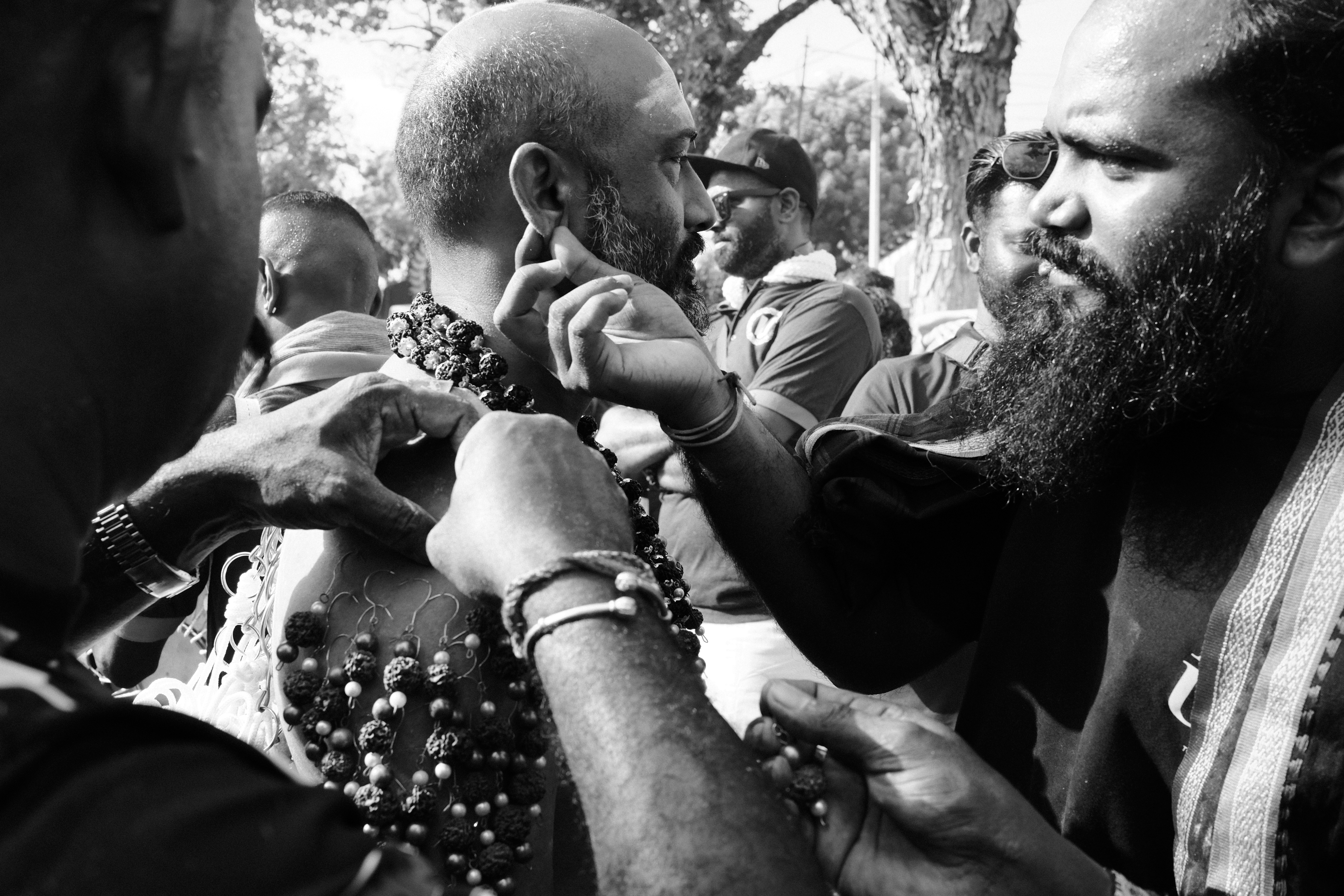 A black and white photo of a man holding a baby