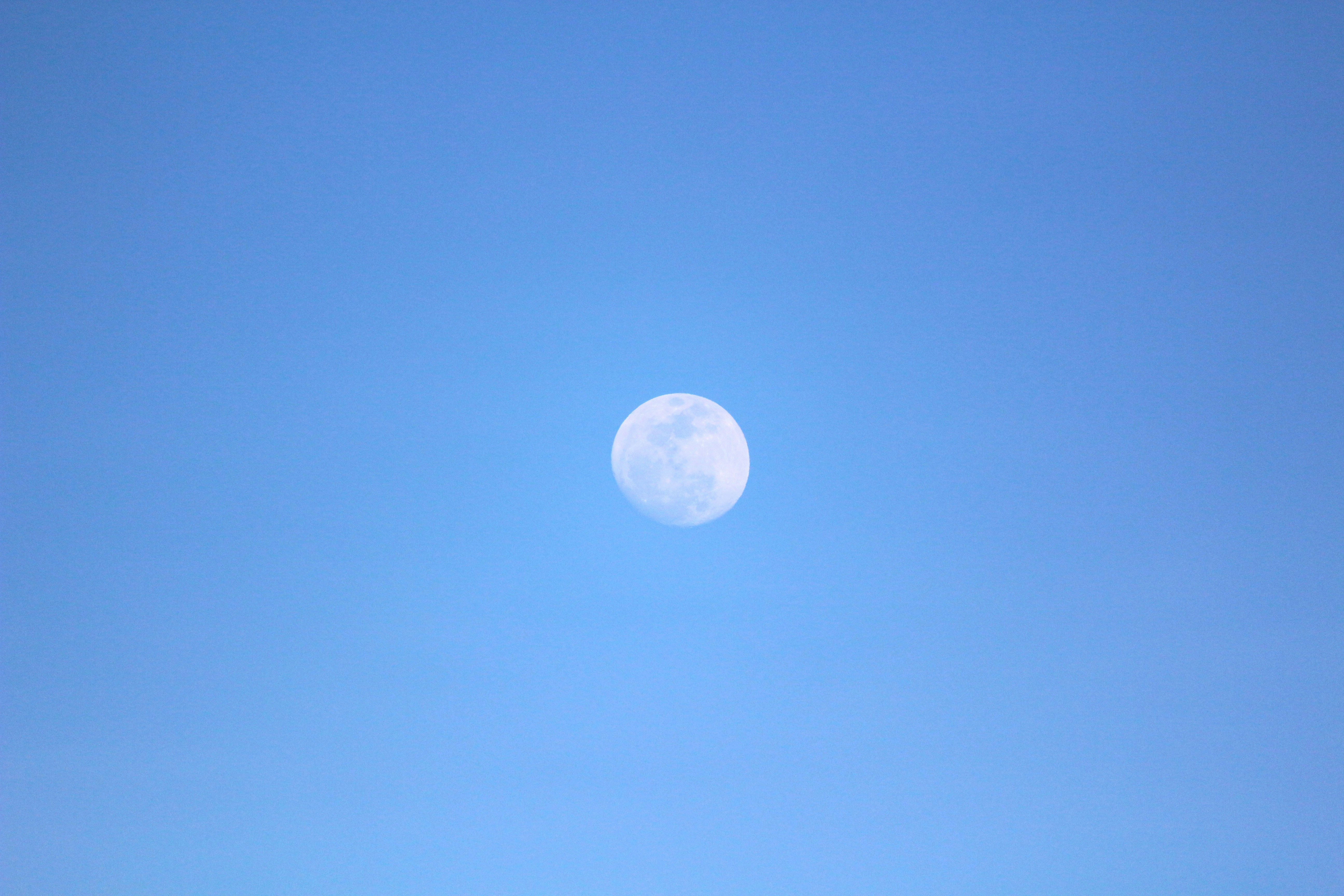 A group of people standing on top of a sandy beach