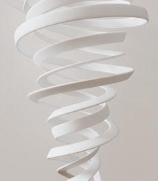 A large white spiral object hanging from a ceiling