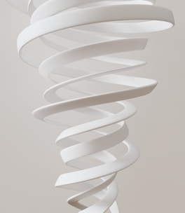 A large white spiral object hanging from a ceiling