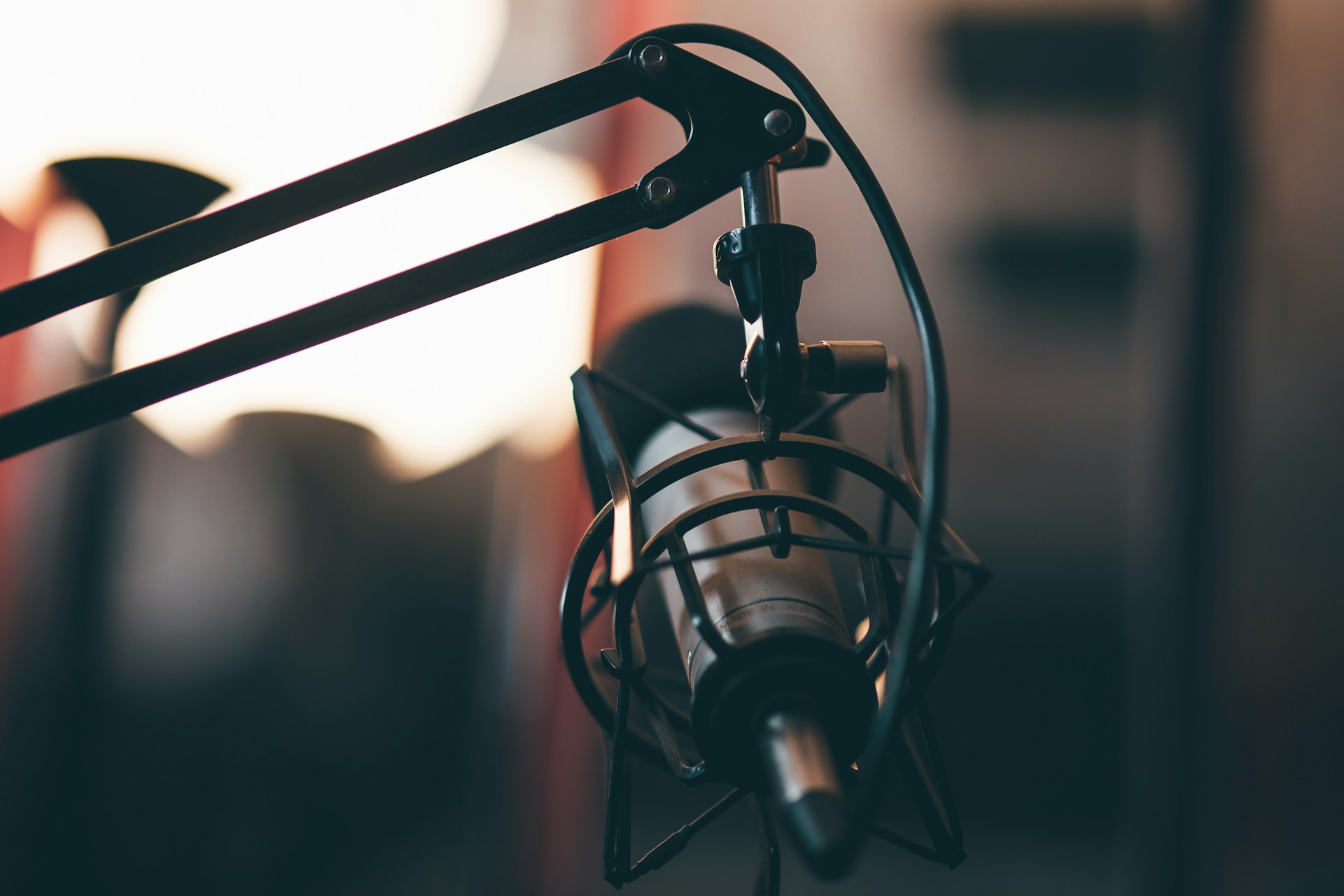 A close up of a microphone with a blurry background