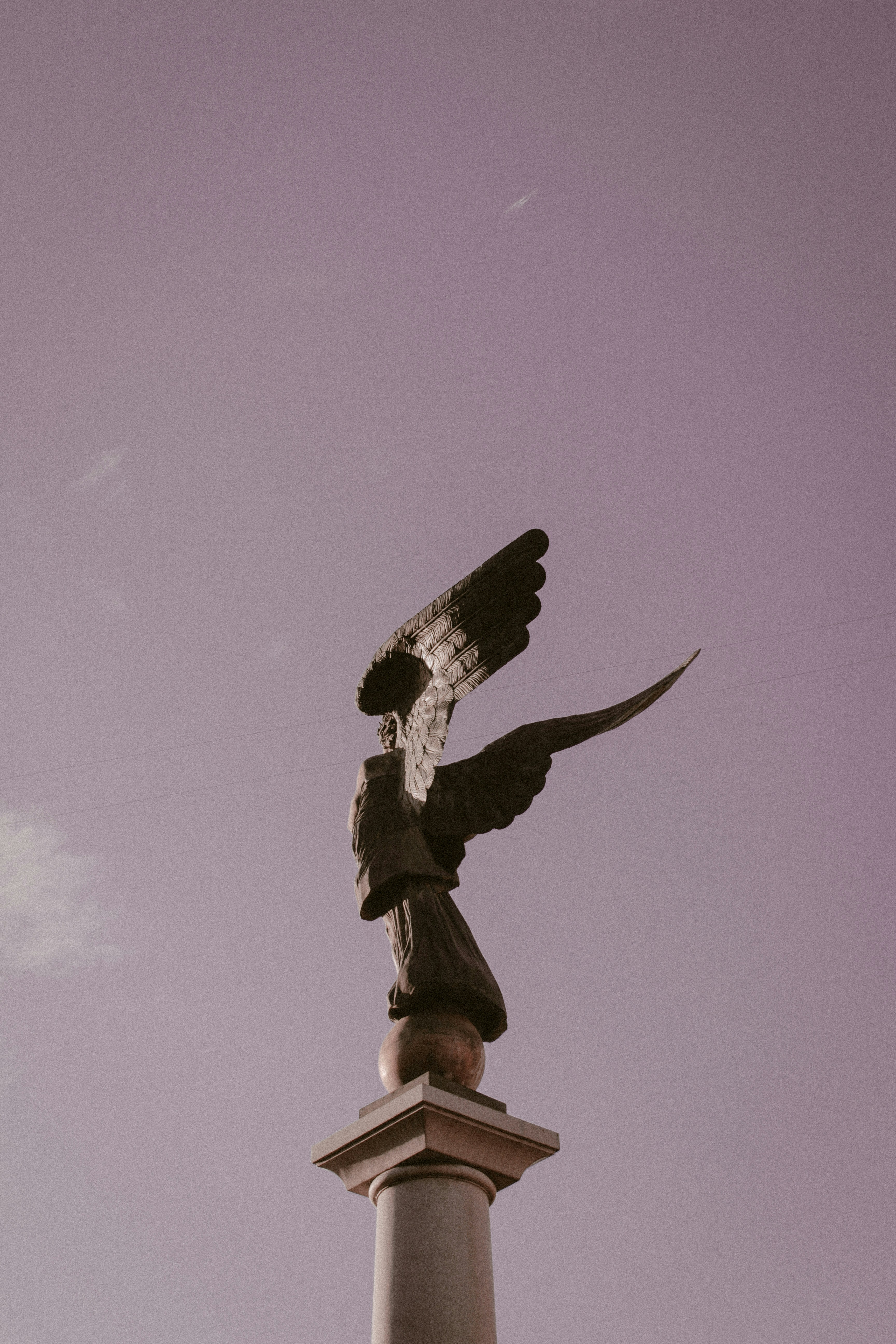 A statue of an eagle on top of a building