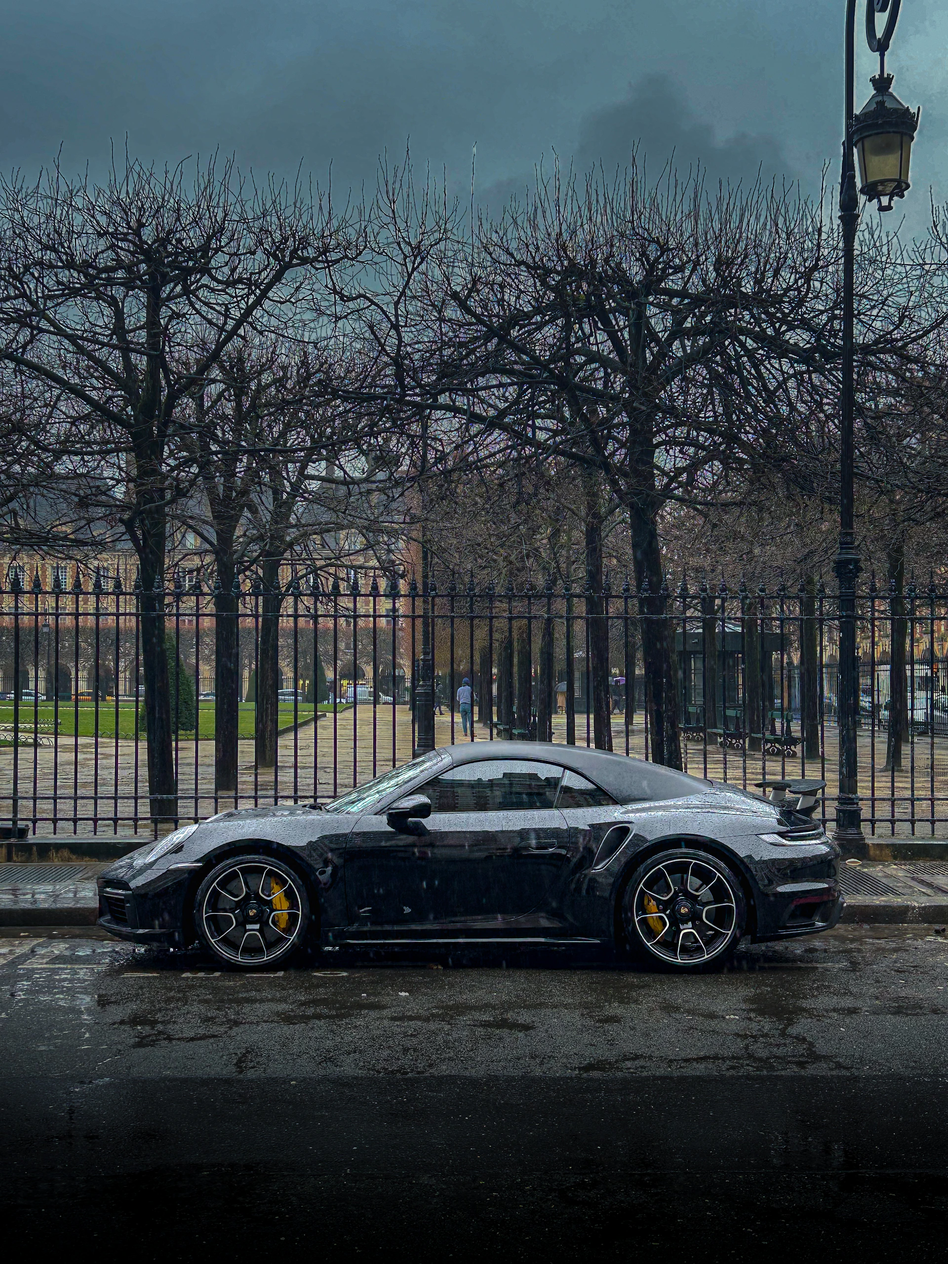 A black sports car parked on the side of the road