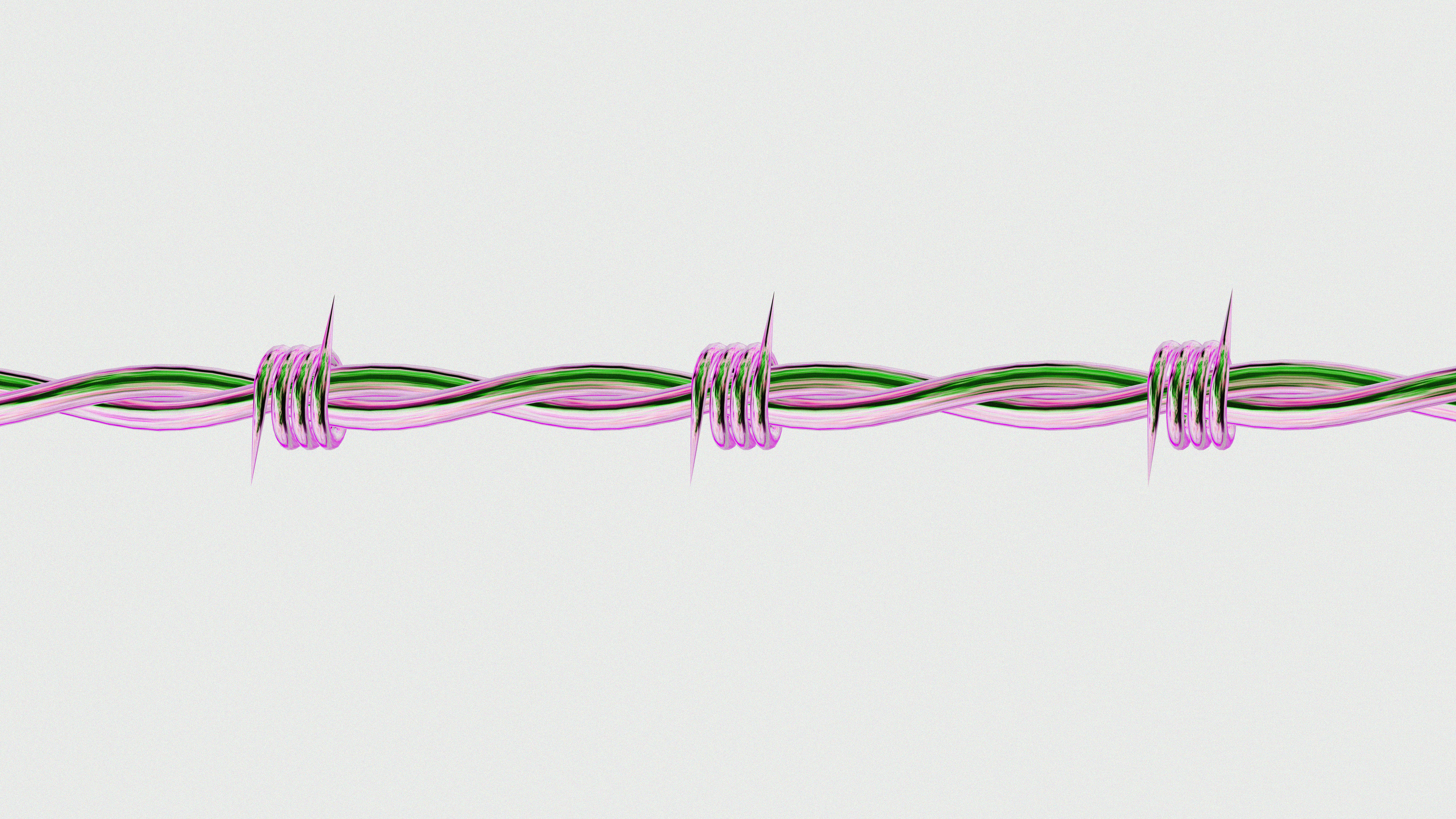 A close up of a pink and green wire