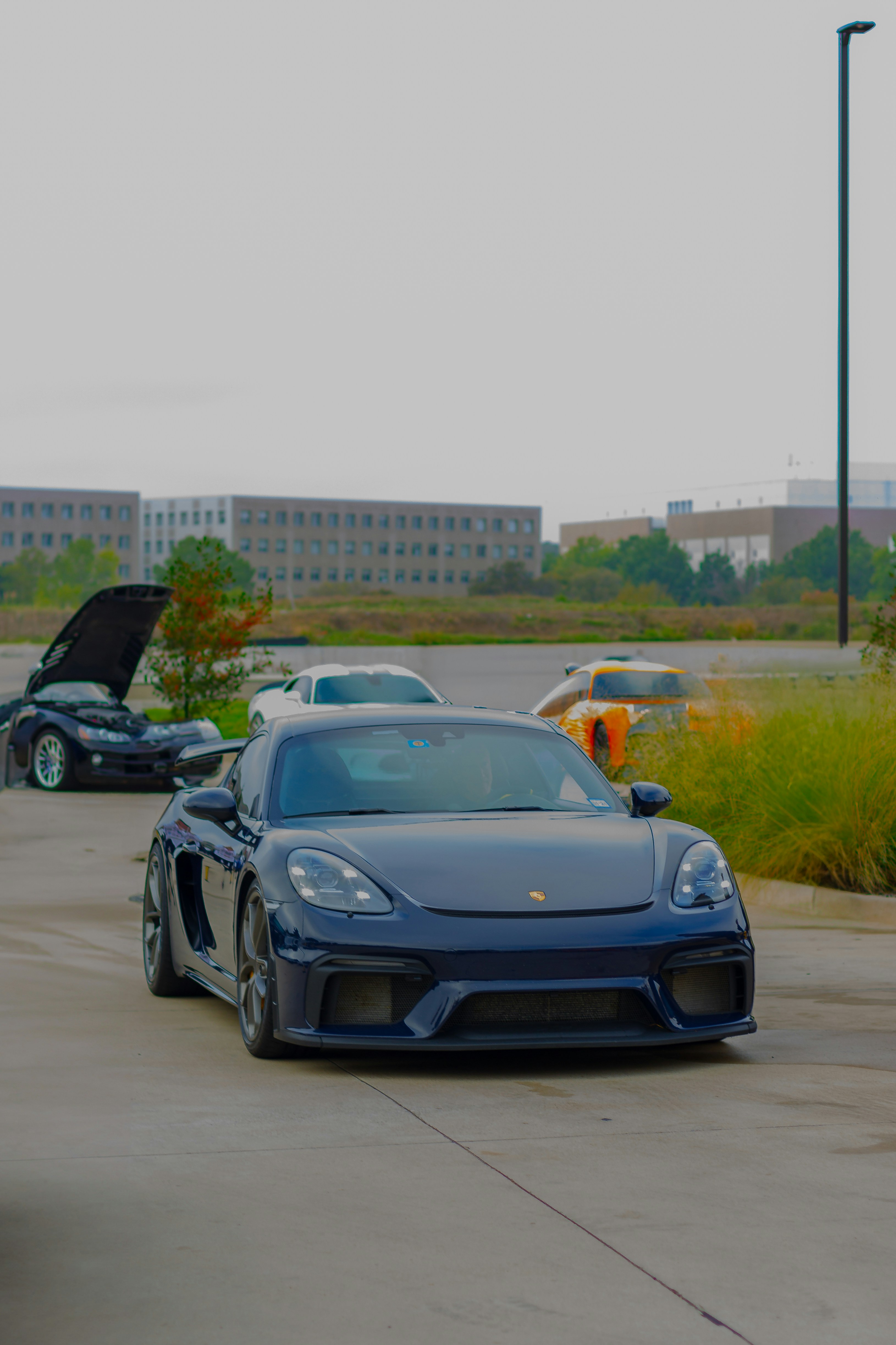 A group of cars parked in a parking lot