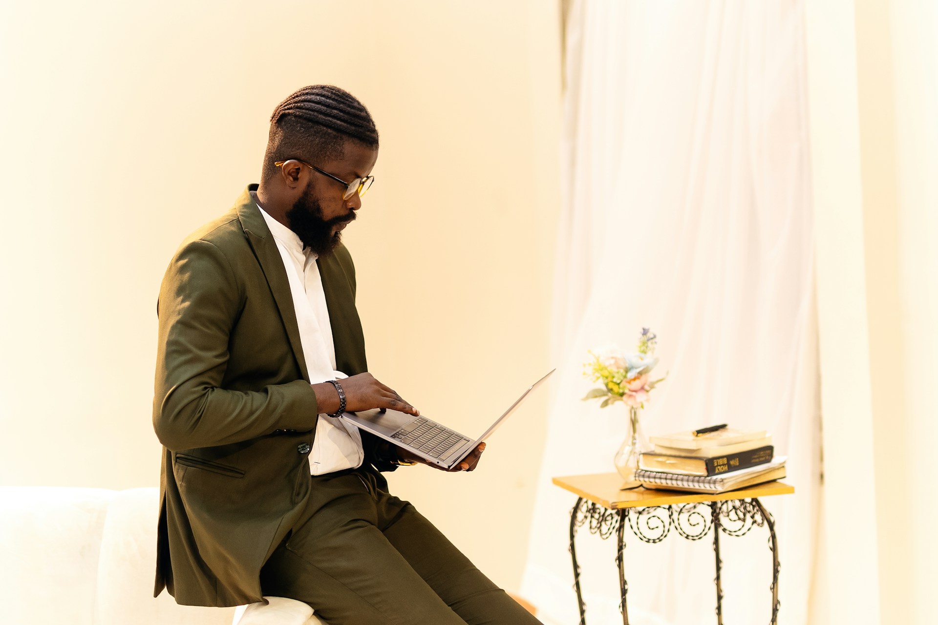 A man sitting on a chair reading a book