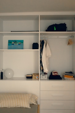 A bedroom with a bed and a closet