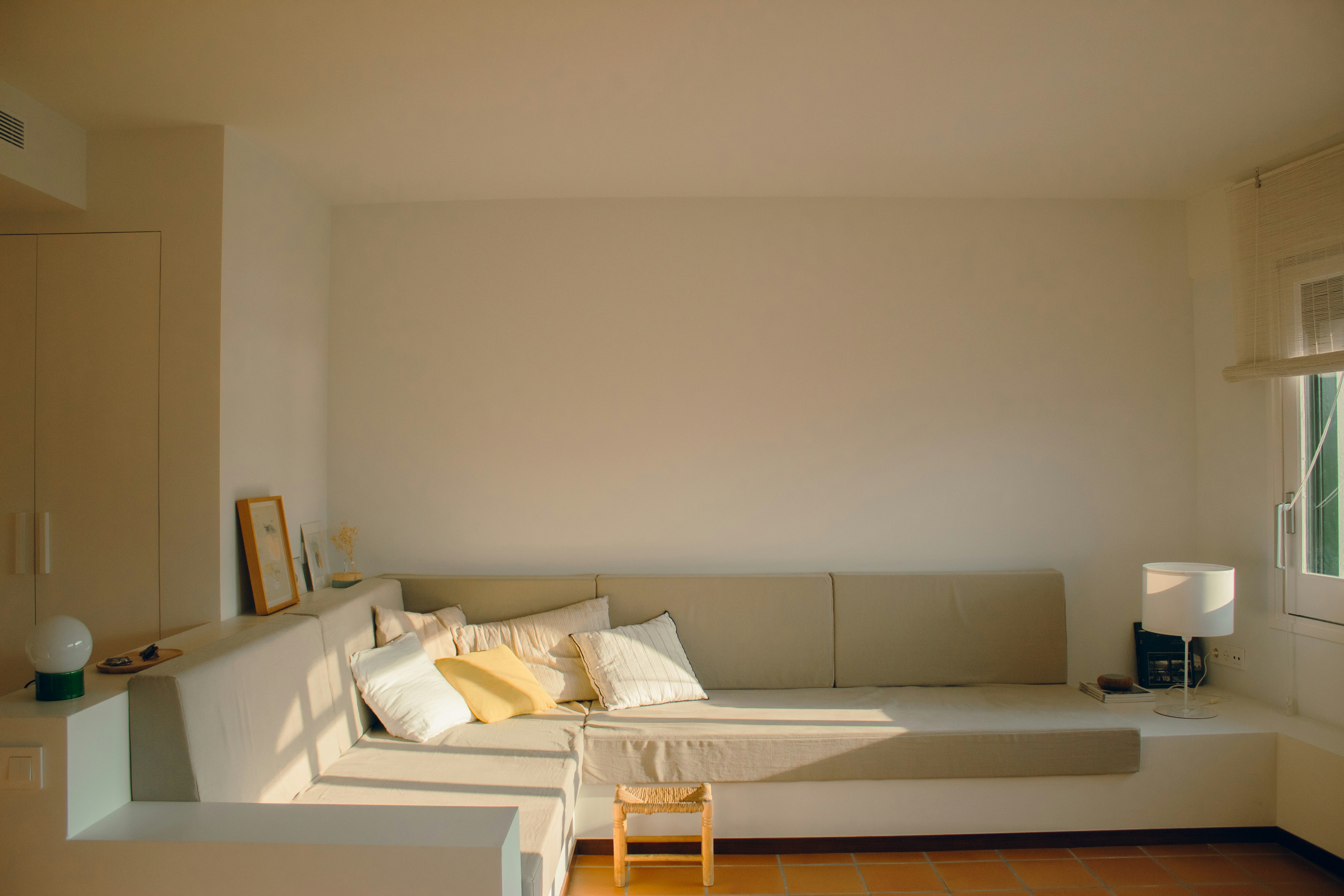 A living room filled with furniture and a window