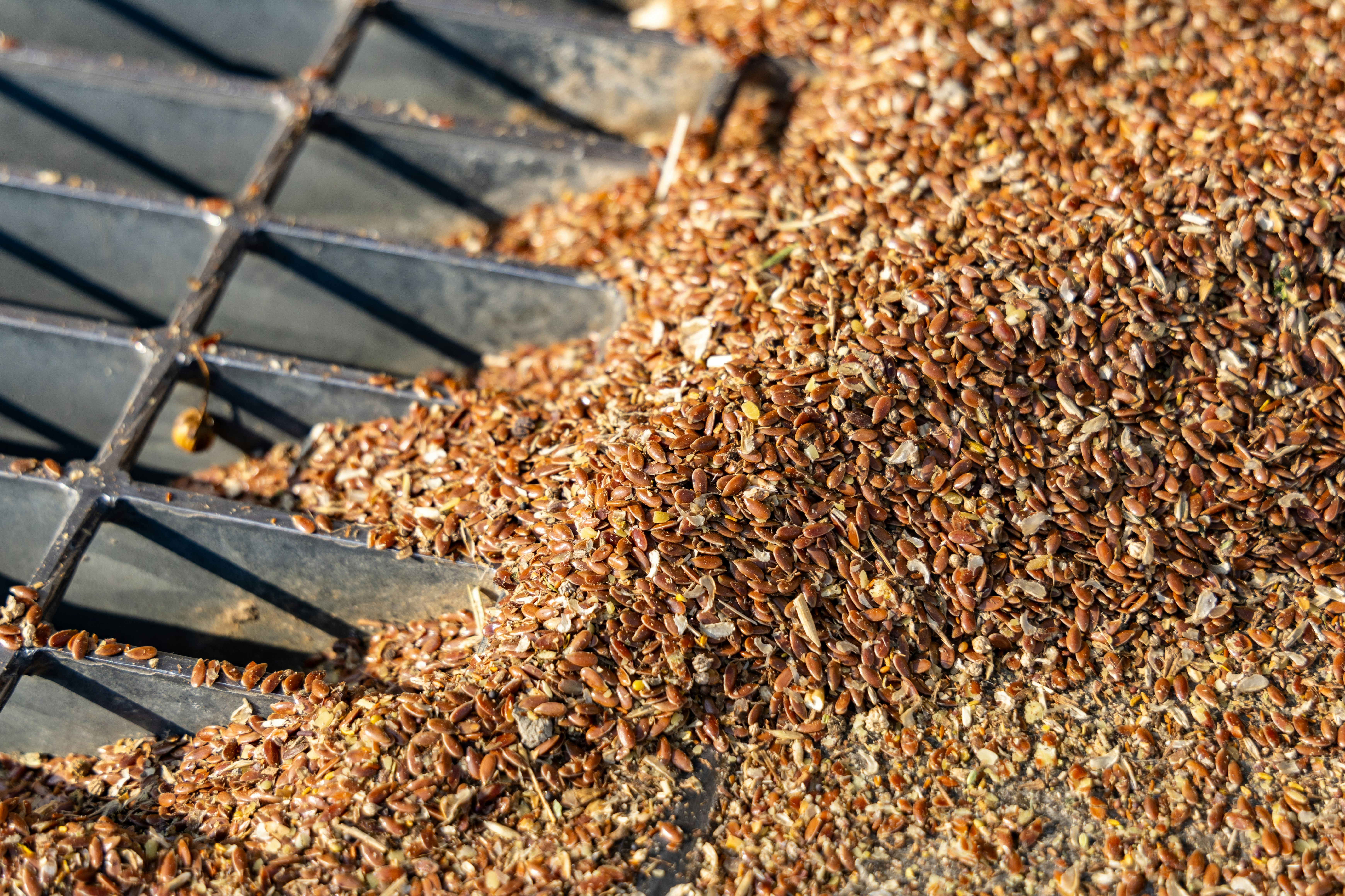A pile of wood chips sitting on top of a metal grate