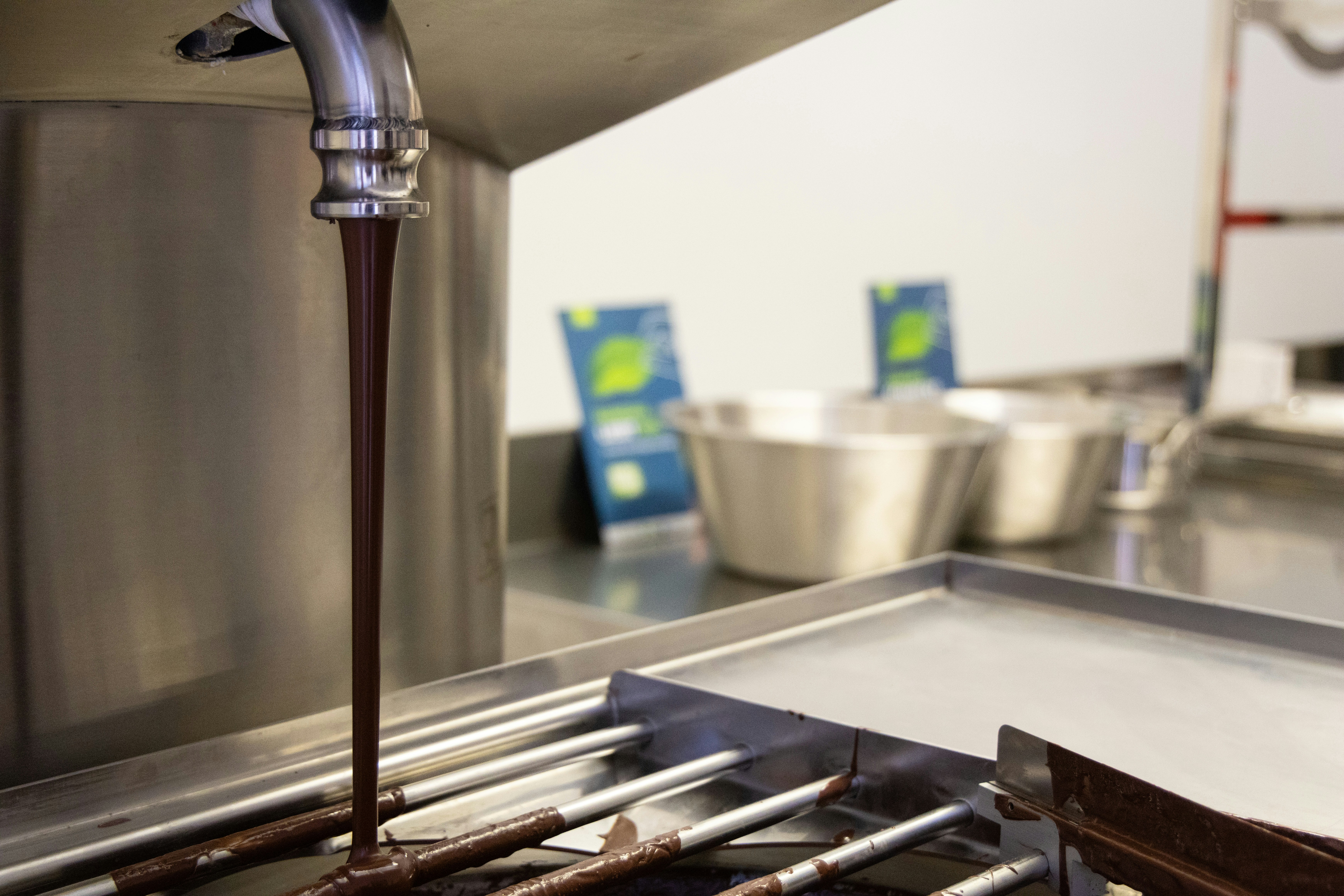 A kitchen with a stove top and a sink with a faucet on it