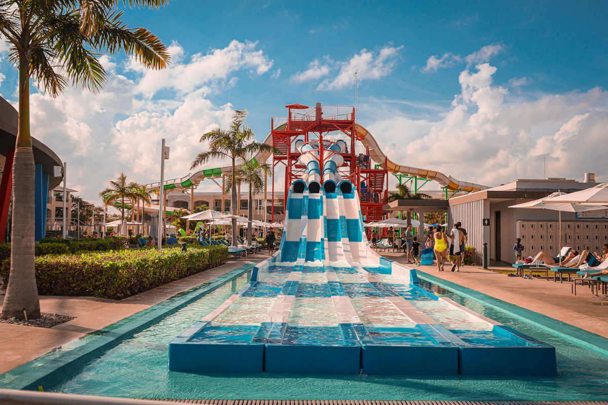 Water park with slides and palm trees at a Caribbean resort