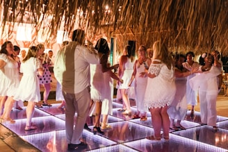 A group of people standing on top of a dance floor