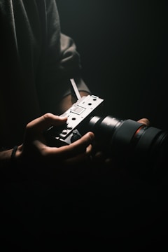 A person holding a camera in their hands