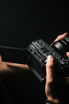 A person holding a camera in their hand