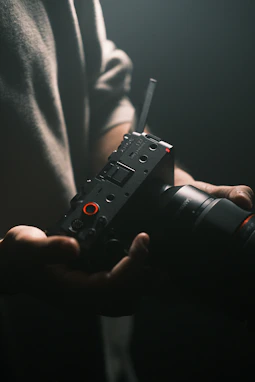 A person holding a camera in their hands