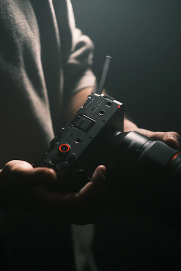 A person holding a camera in their hands