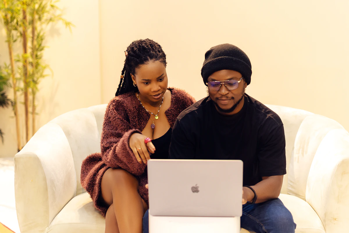 Couple at home browsing on a laptop