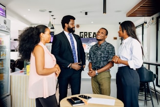 A group of people standing around a table